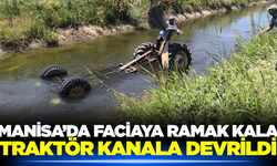 Manisa'da buğday yüklü traktör kanala devrildi