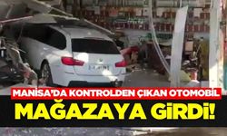 Manisa'da kontrolden çıkan otomobil mağazaya girdi
