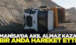 Manisa'da park halindeki kamyon hareket edip devrildi